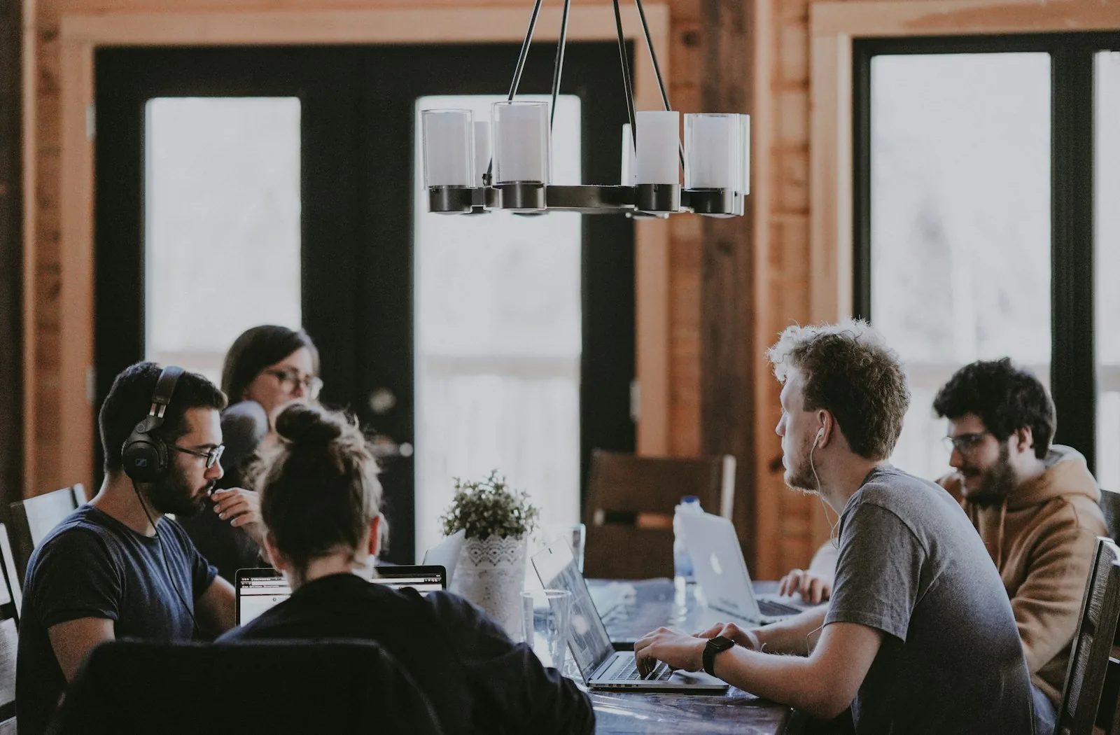 System Slash technology team collaborating around a conference table